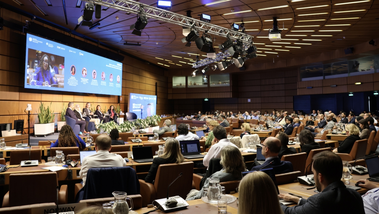 Audience of the Vienna Food Safety Forum with speakers on the podium